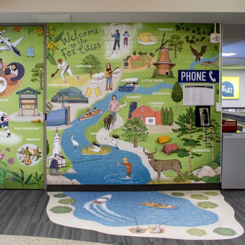 Mural at Appleton Airport welcoming visitors with local scenes by Annie Davidson