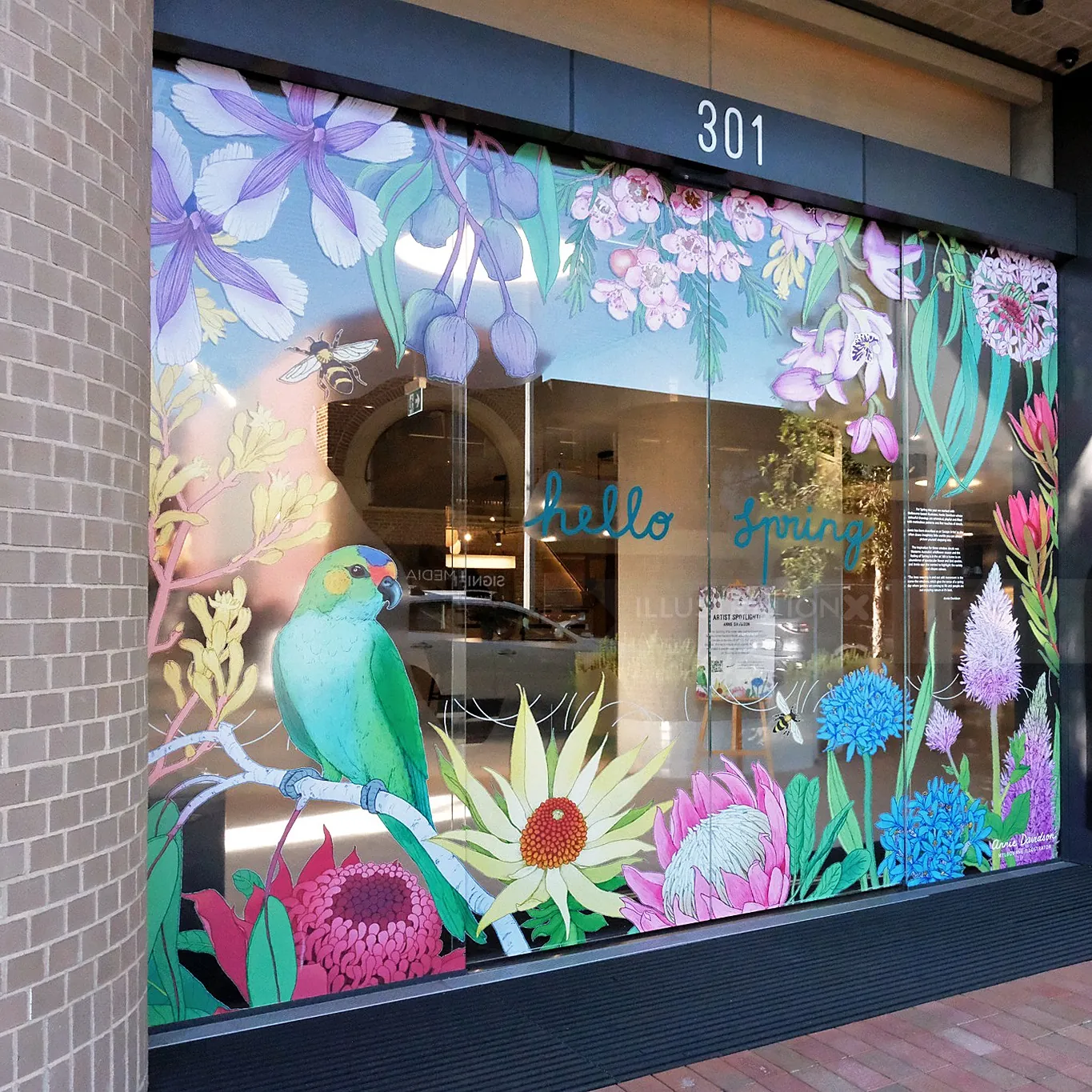 Spring-themed window decals with flowers and a bird by Annie Davidson