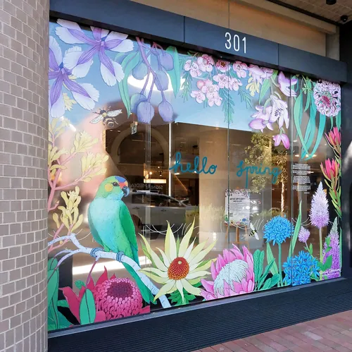 Spring-themed window decals with flowers and a bird by Annie Davidson