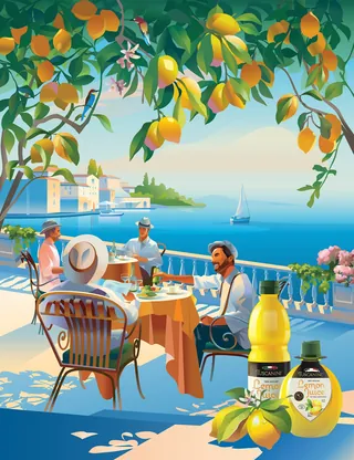 Group dining outdoors near lemon trees with ocean and sailboat in background