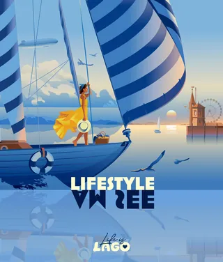 Woman on sailboat with blue striped sails at sunset near city waterfront.