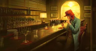 Young man in red cap sitting alone at dimly lit bar