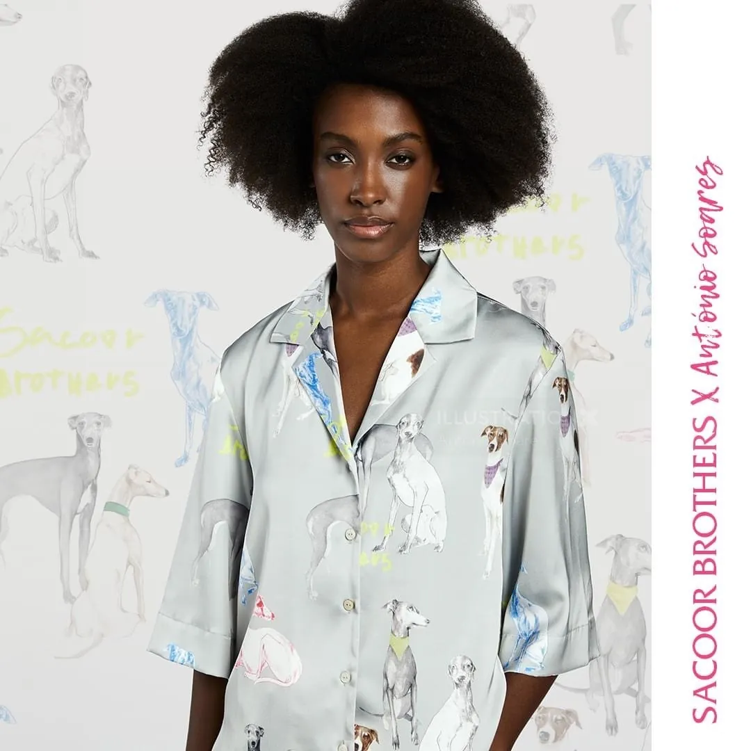 Model in grey shirt with colorful dog illustrations