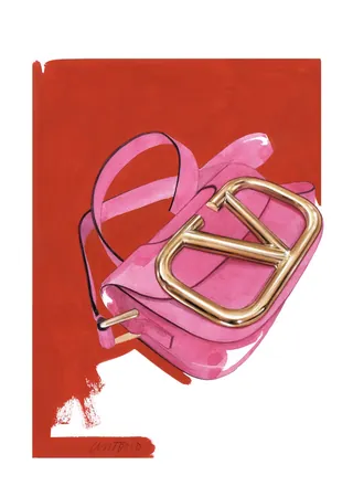 Pink handbag with gold buckle on red background