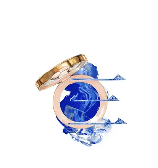 Makeup compact with blue paint splash and brush strokes