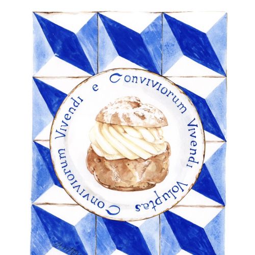 Cream pastry inside blue geometric frame with Latin text by Antonio Soares