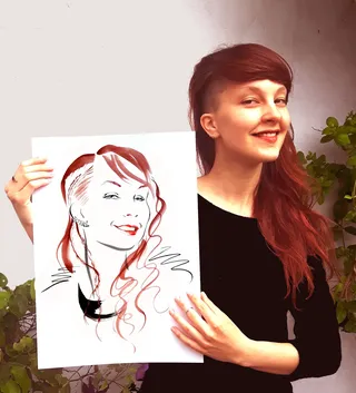 Beauty showing her drawing
