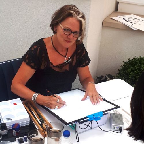 Katharine asher sketching at live event
