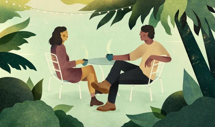 Man and woman sitting at table in garden by Barbara Tamilin