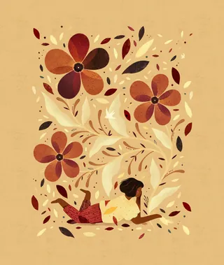 Person lying on stomach with large autumn flowers and swirling leaves