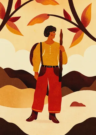 Woman holding walking stick among autumn leaves and mountains by Barbara Tamilin