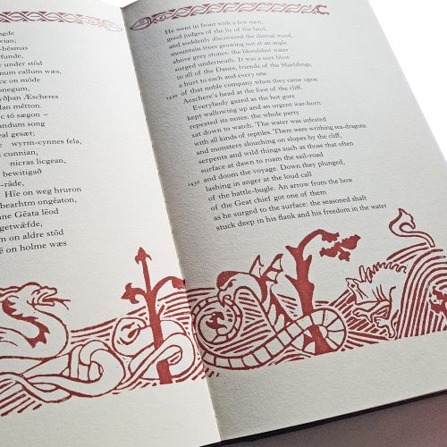 Double page spread from Beowulf by Seamus Heaney, with an Anglo Saxon-inspired linocut illustration 
