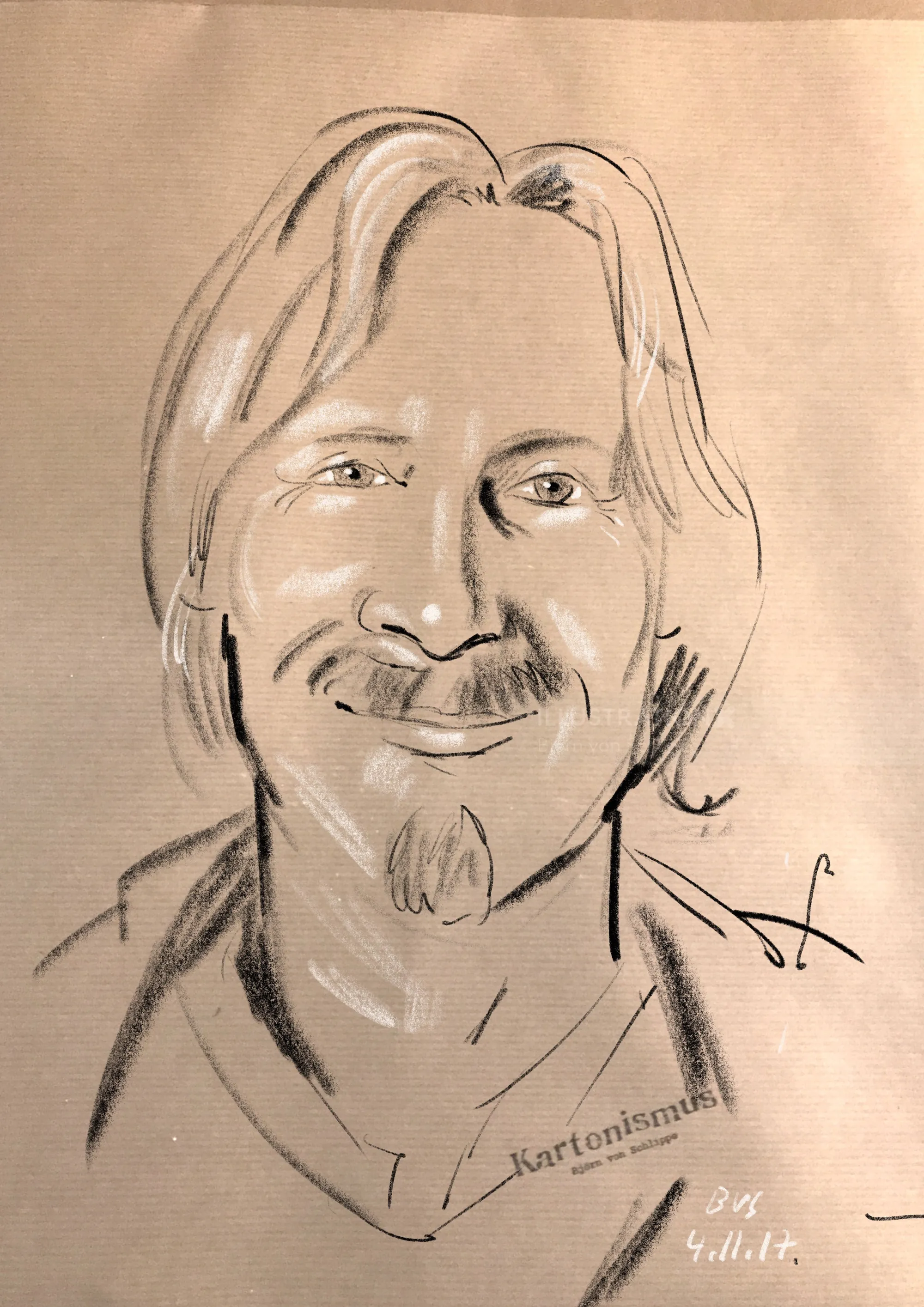 Charcoal portrait of a smiling man by Björn von Schlippe