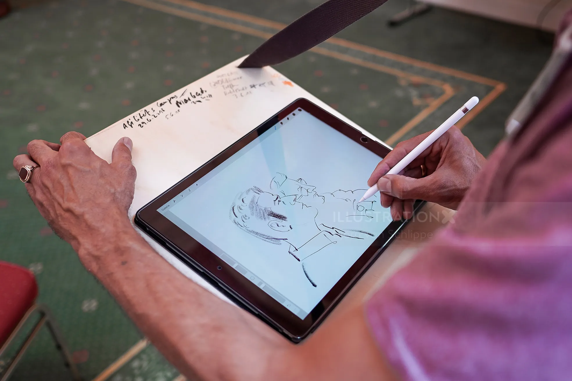 Person drawing a digital portrait on tablet with stylus by Björn von Schlippe