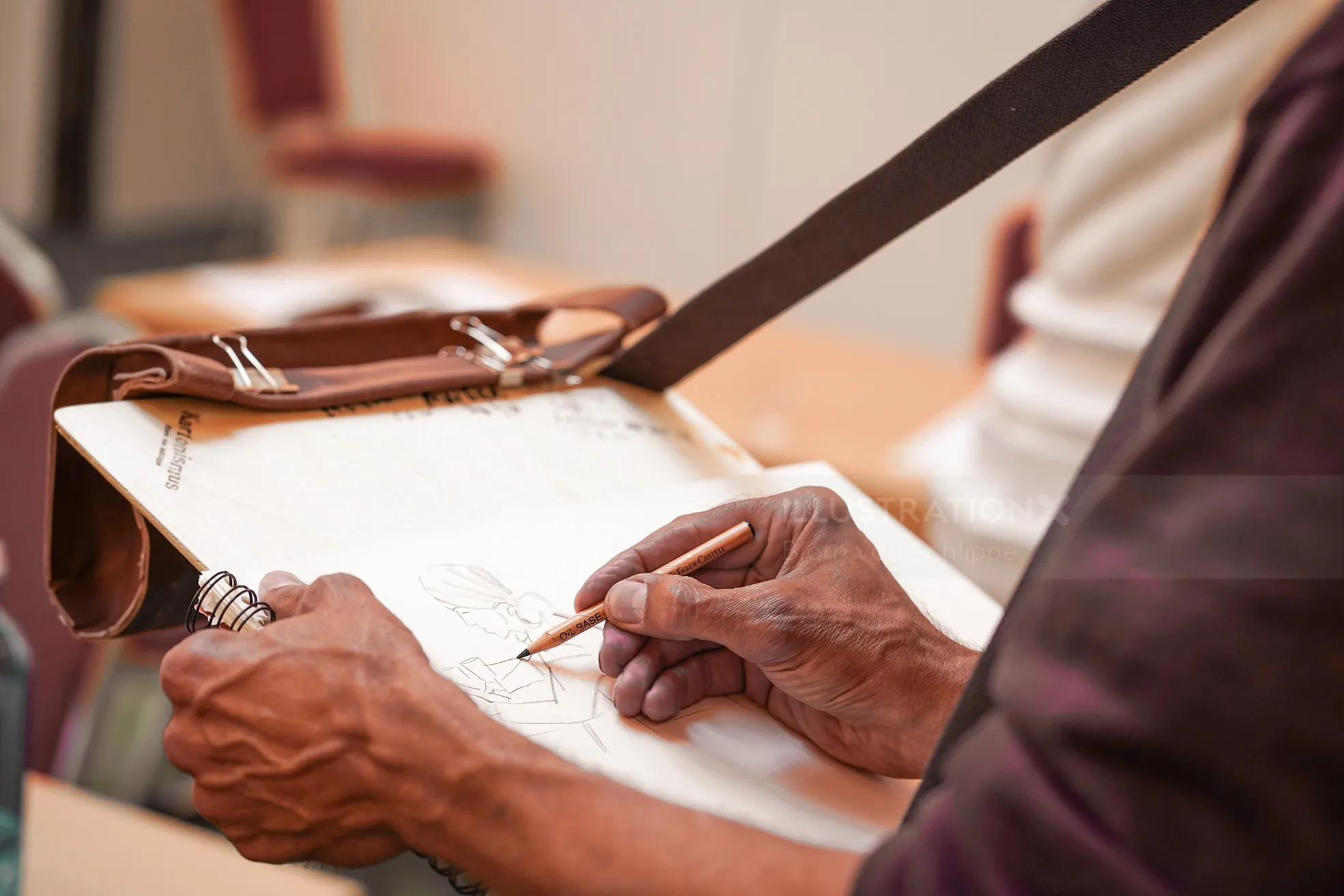 Artist Björn von Schlippe sketching on clipboard with pencil