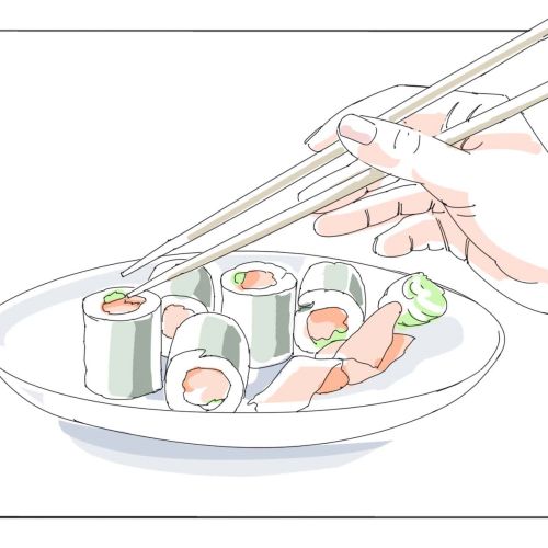 Hand using chopsticks to pick sushi from plate by Björn von Schlippe