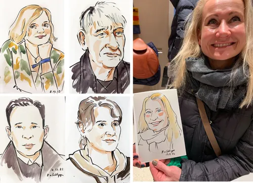 Smiling woman holding her caricature portrait at an art event