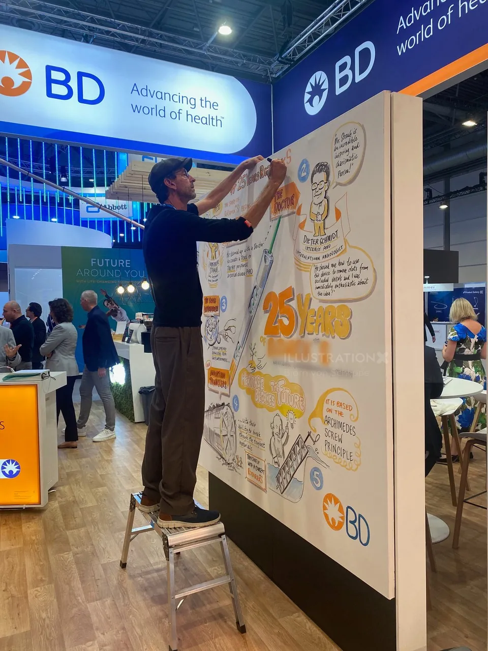 Man drawing on large poster at BD health event booth
