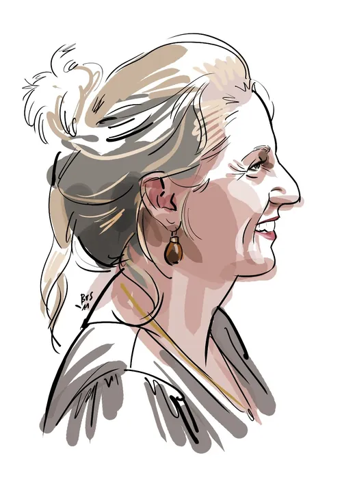 Profile of a smiling woman with tied-back hair and earrings by Björn von Schlippe