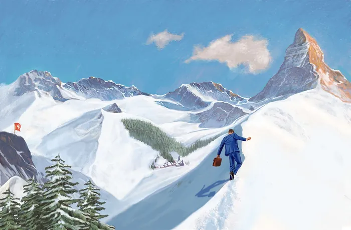 Hiker walking on snow-covered mountain ridge with mountains in background