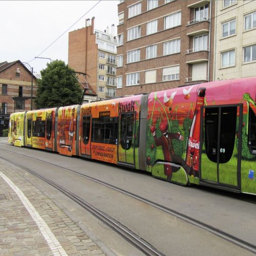 Colorful tram on urban tracks by Bob Venables
