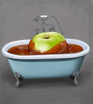 Green apple soaking in a bathtub filled with sauce by Bob Venables