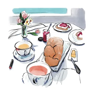 Cozy tea setting with bread, jam, two cups, and flowers by Briana Kranz