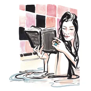 Woman reading book in bathtub with pink tiled wall by Briana Kranz