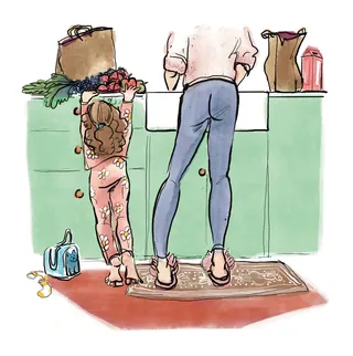 Child and adult washing dishes together at kitchen sink