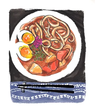 Bowl of Japanese curry udon with boiled eggs and vegetables