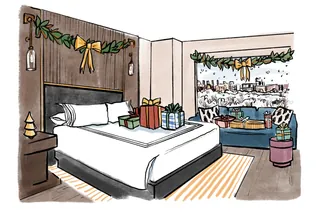 Holiday decorated hotel room with bed, garlands, and wrapped presents