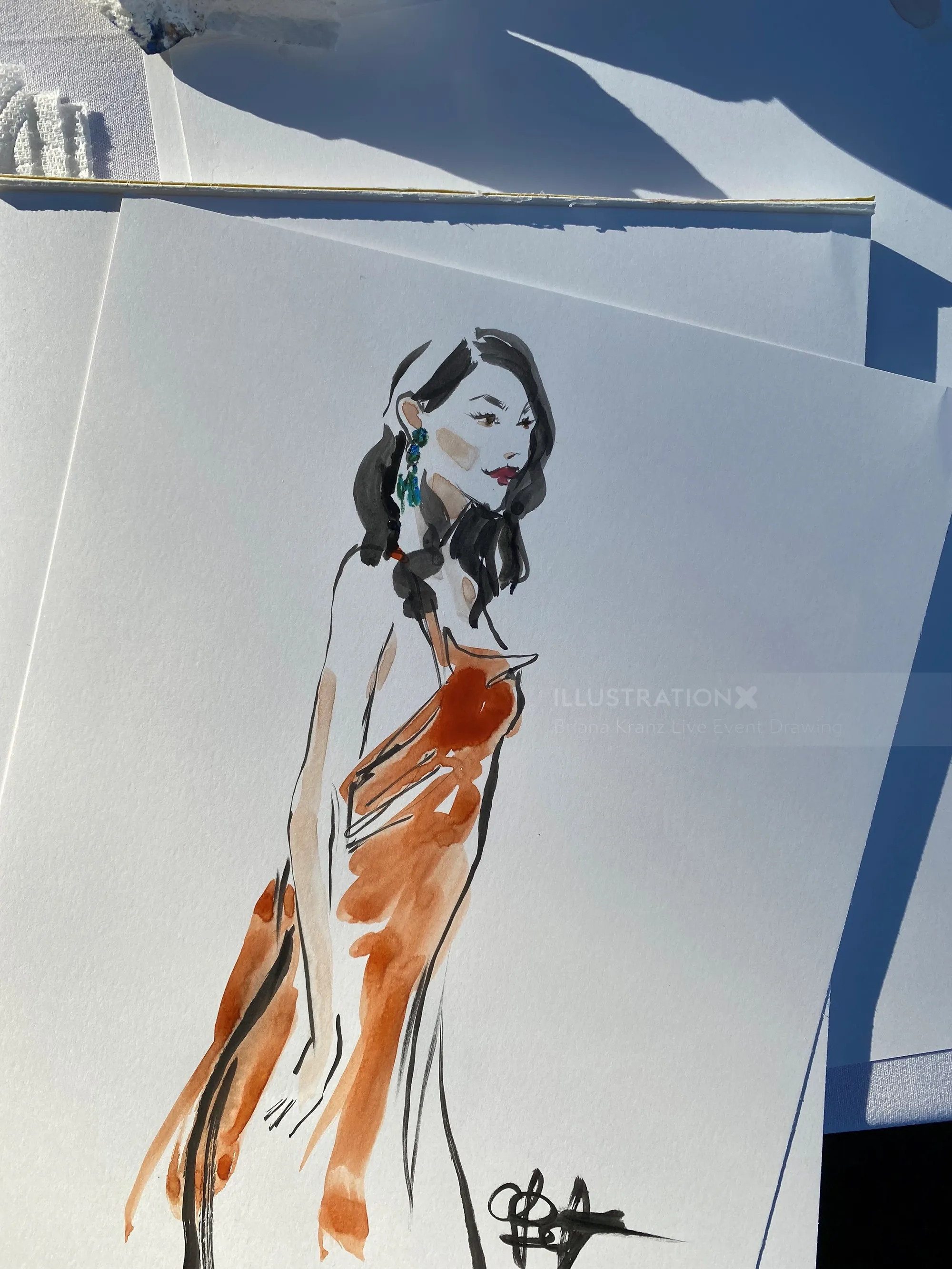 Stylized drawing of a woman in an orange dress by Briana Kranz