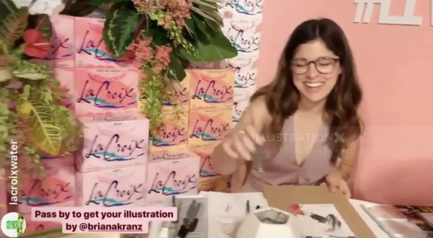 Woman artist drawing at live event with LaCroix cans and plants background by Briana Kranz