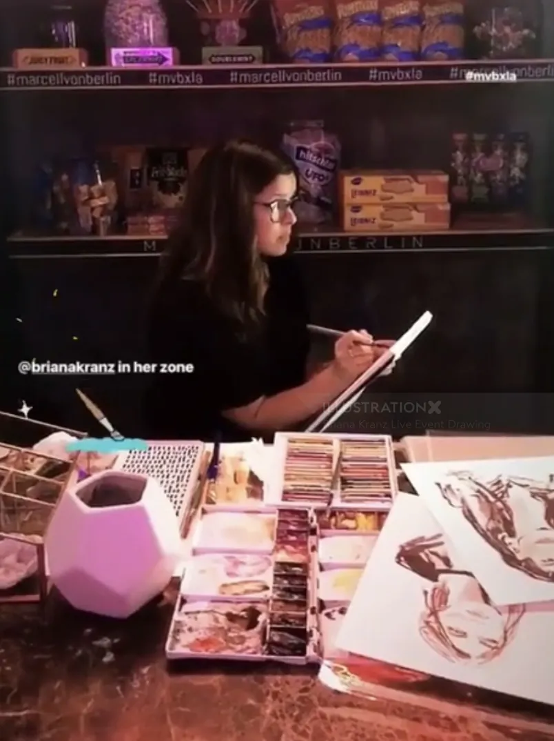 Artist Briana Kranz drawing with colored pencils at a live event