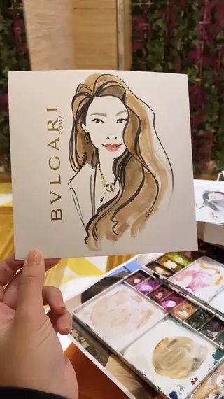 Portrait of a woman with flowing hair and Bvlgari logo by Briana Kranz