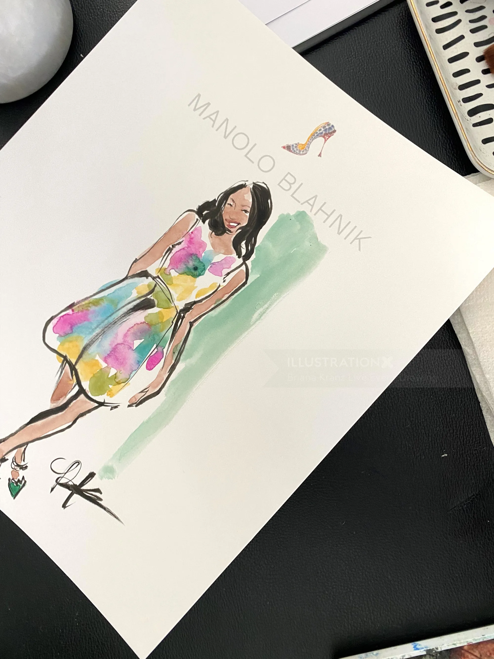 Fashion sketch of woman in multicolor dress with Manolo Blahnik logo
