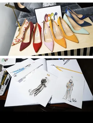 Colorful high heel shoes and fashion sketches on table