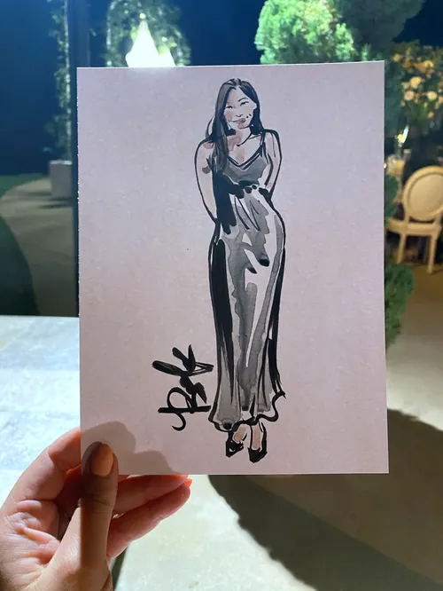 Ink sketch of a woman in a long dress held by hand