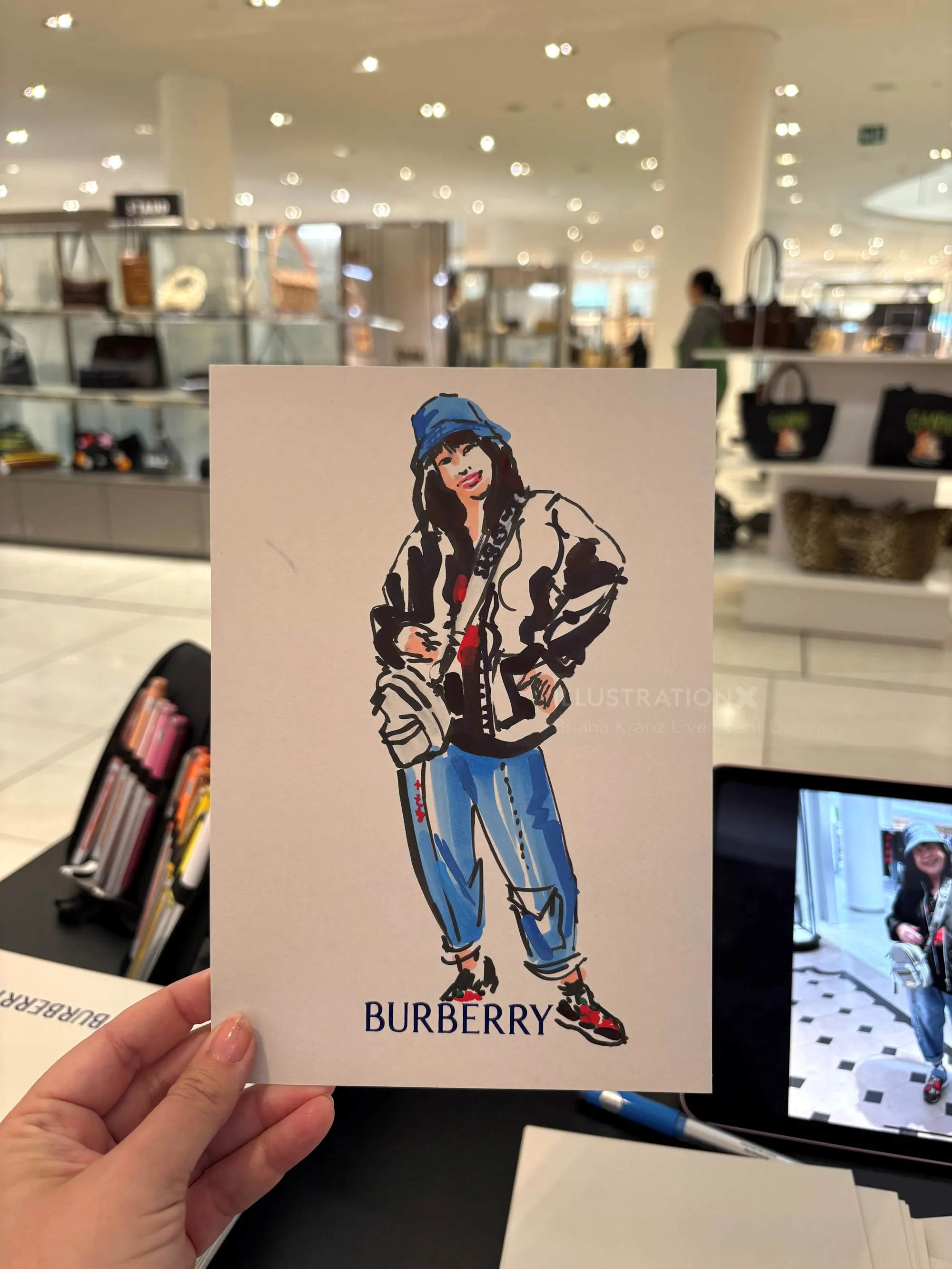 Fashion illustration of a figure wearing Burberry jacket and jeans by Briana Kranz