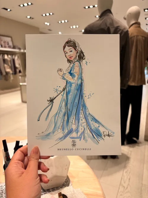 Briana Kranz illustration of a woman in a blue gown at Brunello Cucinelli