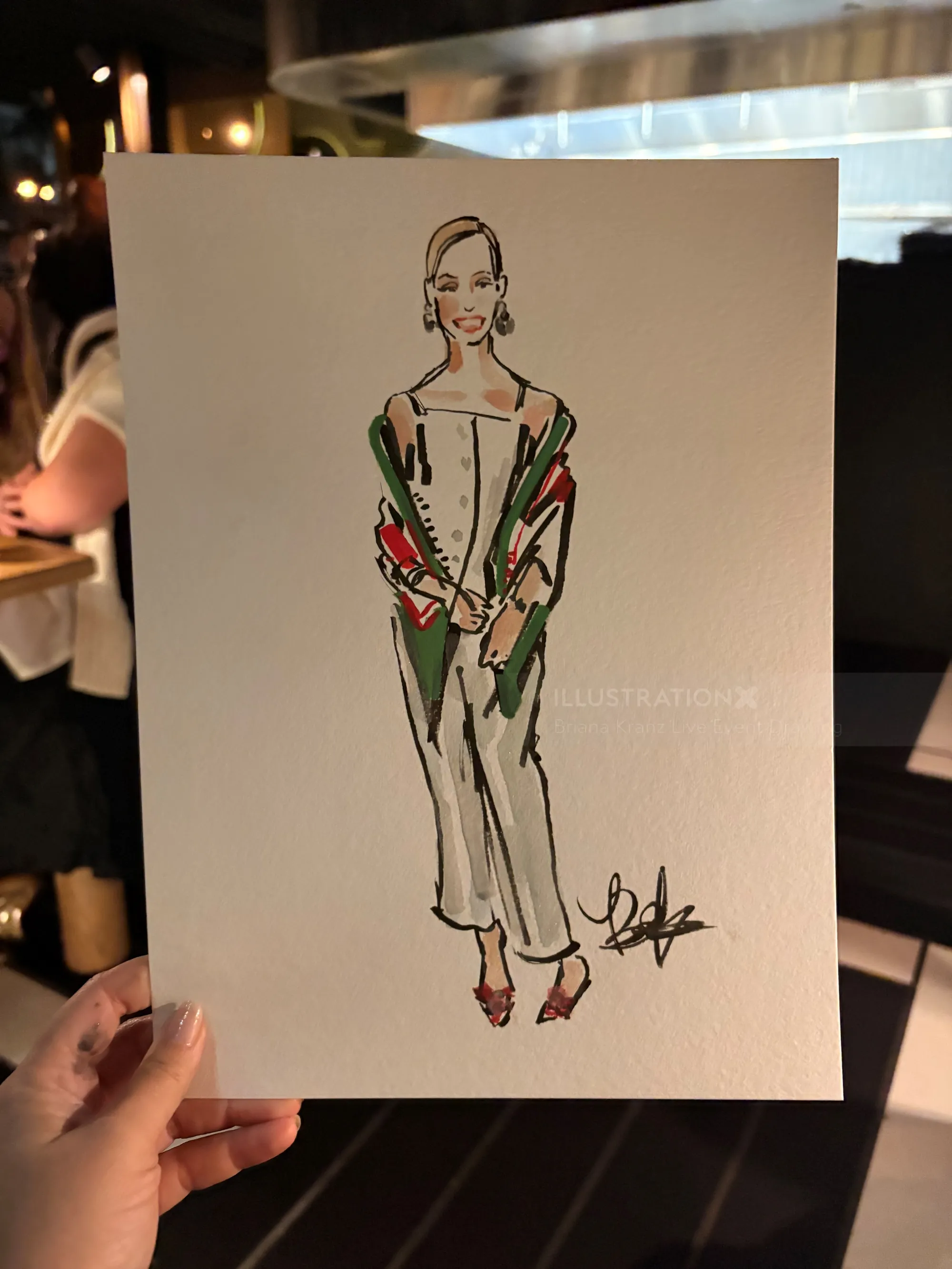 Briana Kranz Live Event Drawing of a woman in a green and red outfit