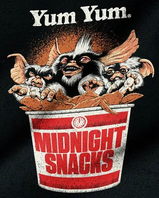 Gremlins in midnight snacks bucket with Yum Yum text above