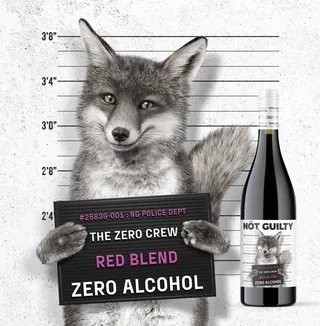 Fox holding mugshot sign with wine bottle labeled Not Guilty by artist CUBE