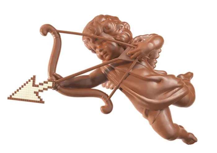 Chocolate sculpture of cupid aiming arrow with pixelated heart tip