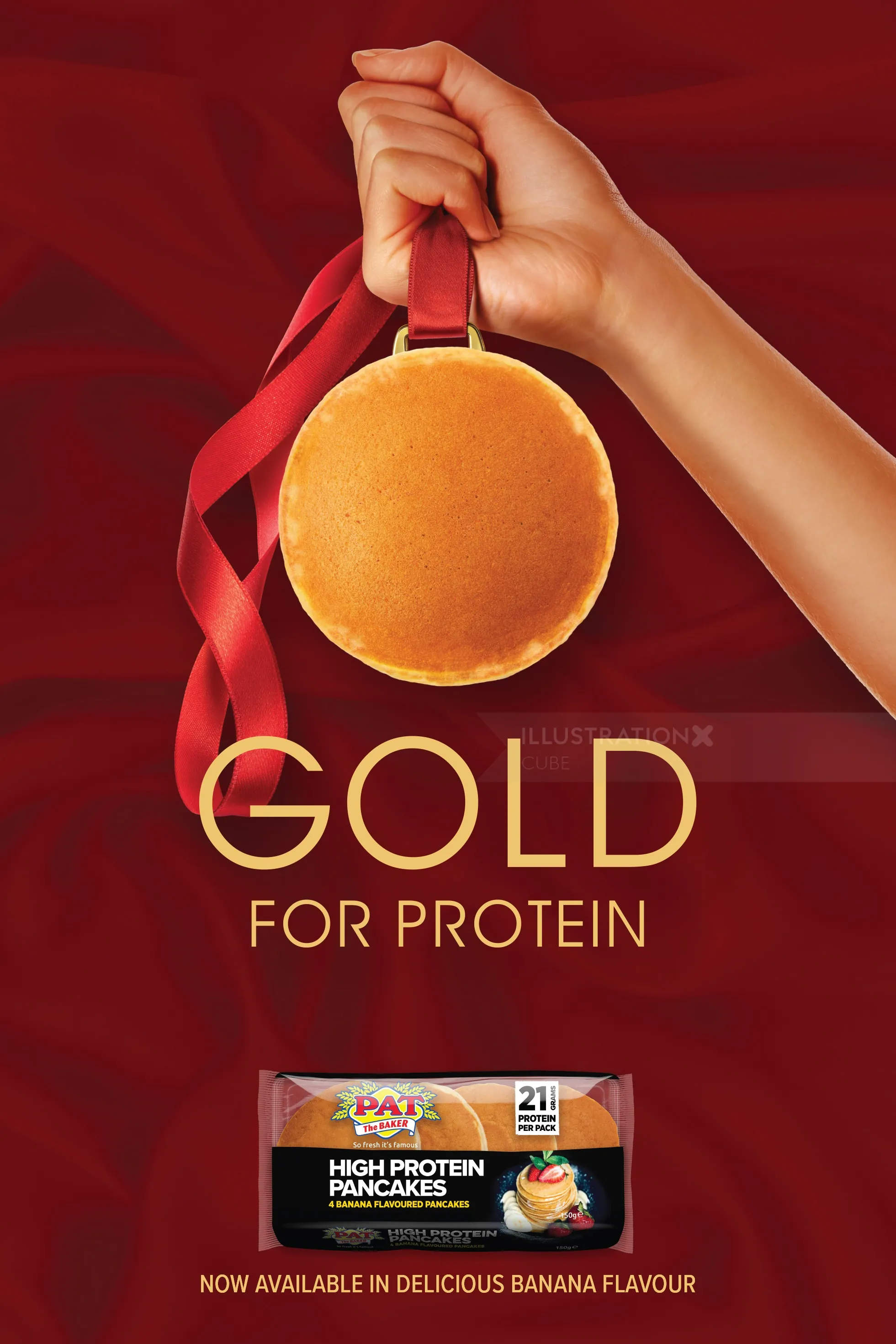 Hand holding a pancake medal with a red ribbon against red background