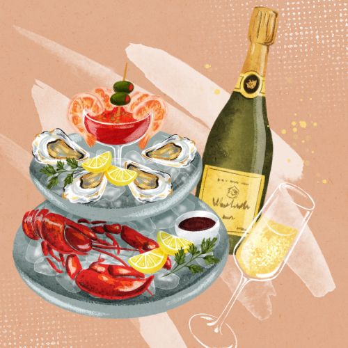Seafood platter with lobster, oysters, cocktail, and champagne by Camila Gray