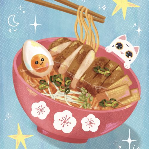 Bowl of ramen with egg and cat peeking over the edge