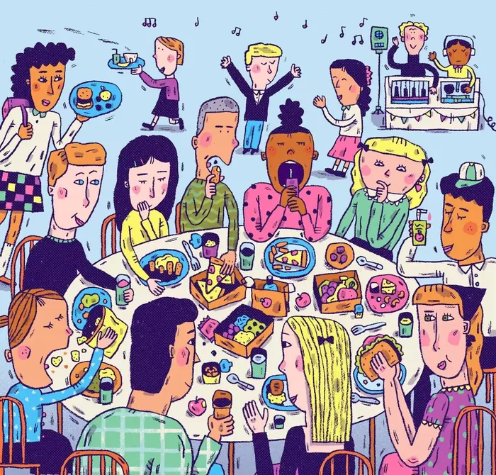 People eating and socializing at a large table with food and drinks