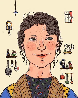 Smiling woman with curly hair in a kitchen surrounded by utensils and plants