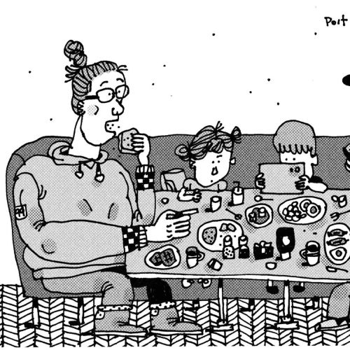 Family of four sitting around diner table eating and talking.